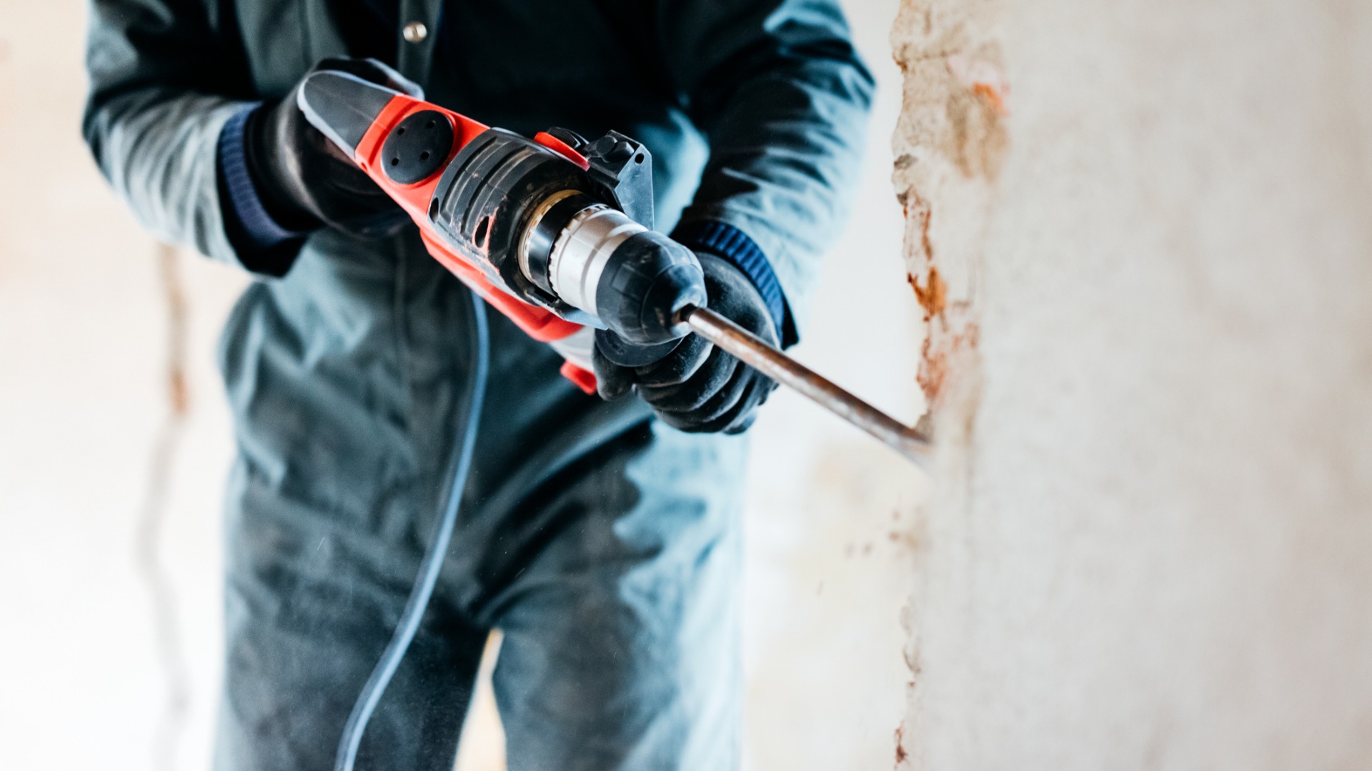 Construction worker fixing wall